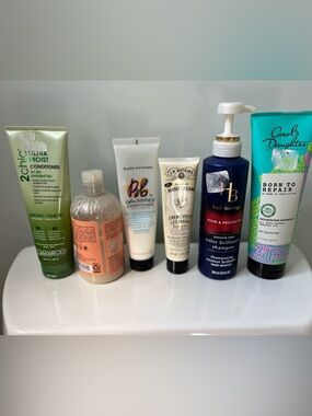 bundle of used hair products - shampoo and conditioner